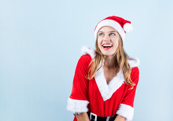 Wall Mural - closeup of caucasian happy woman wearing santa clothes looking away