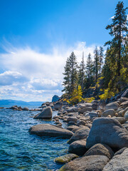 Wall Mural - Tranquil Lake Tahoe with clean blue water, dramatic clouds, and glacial rocks and boulders in Logan Shoals Vista Point in Nevada