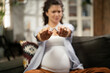 Beautiful pregnant woman refuses to smoke cigarette. Healthy life choice..