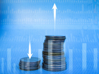 Two rows of coins showing rising and falling profits on a blue background. Creative graphics, abstraction, money and finance symbol. Business, economic concept