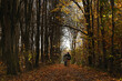 Young adult son and mother on road in the autumn forest. Pavel Kubarkov, i and my Mother Marina and autumn forest around us. Photo was taken 8 October 2022 year, MSK time in Russia.