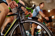 Closeup cycling training on bike at gym club