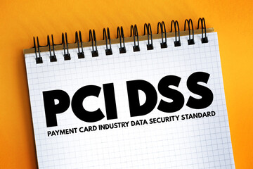Poster - PCI DSS - Payment Card Industry Data Security Standard acronym text on notepad, IT Security concept background