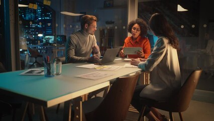 Poster - Positive Group of Managers Having a Team Meeting Long After Work Hours in the Night. Inspired Colleagues Discussing Annual Financial and Marketing Reports. Teamwork in Creative Office.
