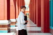 © Andrii - Businesswoman portrait. Caucasian female business person walking outdoor with business paper document holder