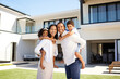Family, happy and new home in summer at property, mortgage and mansion backyard. Parents, children and smile for piggyback on grass at luxury, real estate or house together for happiness in Atlanta