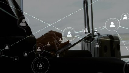 Poster - Animation of network of profile icons over caucasian businessman using digital tablet at an airport