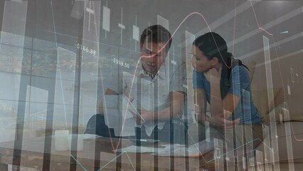 Canvas Print - Animation of statistical data processing against stressed caucasian couple calculating finance