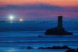 La Vieille lighthouse illuminated at night