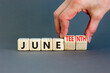 © Dzmitry - Juneteenth in June symbol. Concept words Juneteenth and June on wooden cubes. Beautiful grey table grey background. Businessman hand. Business Juneteenth in June concept. Copy space.