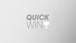Illustration saying 'Quick win'. Quick win concept illustration. Grey, silver background with letters and symbol of a trophy saying 'quick win'. Business buzzword slide background. 
