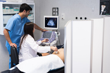 Doctor examining patient with ultrasound scan