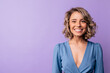 © Look! - Happy young caucasian woman smiling broadly on purple background with space for text. Blonde wavy hair wears blue blouse. Emotion concept