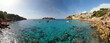 Panoramic photo of of a  beach in Mallorca. Beautiful view of the seacoast of Mallorca with an amazing turquoise sea, in the middle of the nature. Concept of summer, travel, relax and enjoy.