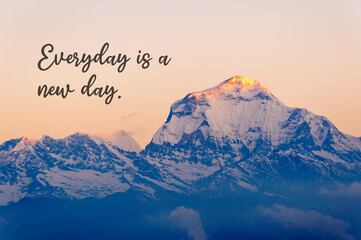 Wall Mural - Snow capped mountain background with inspirational quotes text - Everyday is a new day