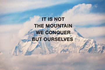 Snow capped mountain background with inspirational quotes text - It is not the mountain we  conquer but ourselves