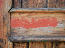 A Fragment Of A Wooden Door With A Remnant Of Orange Paint