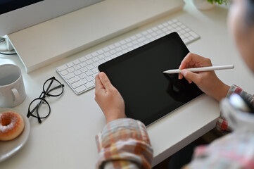 Poster - an asian female graphic designer using digital tablet to design her creative artwork