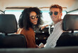 © K Abrahams/peopleimages.com - Couple, travel and adventure, happy in car on roadtrip during summer vacation for bonding and healthy relationship. Young man and black woman, transportation and romantic date together in portrait.