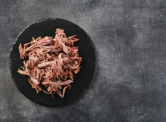 Wall Mural - Traditional barbecue pulled pork. Slow cooked pulled pork shoulder. Juicy pork meat cooked in a smoker by low and slow