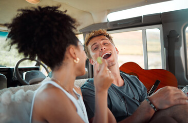 Sticker - Couple eating on road trip, people travel in car with friends and vacation in Canada together. Black woman giving grape to boyfriend, funny man with open mouth and interracial love in camper drive