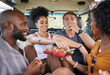 © Siphosethu Fanti/peopleimages.com - Diversity, food and friends on road trip with fruit while on holiday vacation eating watermelon, grapes and strawberry. Happy and hungry young men and women enjoying healthy fresh organic produce