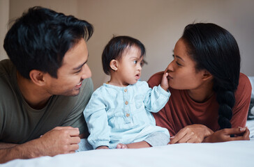 family, parents and down syndrome baby with love, care for relaxing and spending quality time togeth
