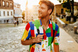 © Drobot Dean - Young handsome smiling redhead man with stubble in colorful shirt