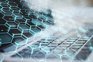 Canvas Print - Close up of laptop with creative blue hexagonal background. Technology, communication and network concept. Double exposure.