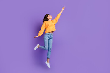 Wall Mural - full body length photo of young sportive woman dancing flying trampoling finger point empty space ad
