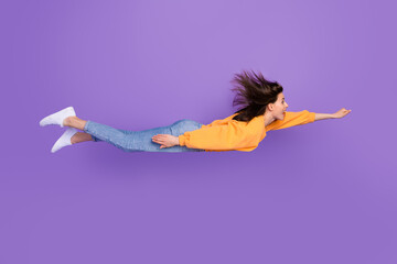 Wall Mural - side profile photo of young funny excited crazy girl flying vertical positive mood childish superher
