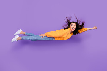 Poster - Full length photo of astonished overjoyed cheerful person wear orange trendy sweater denim rush party isolated on purple color background