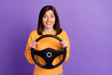 Wall Mural - Photo of cheerful lady wear orange trendy pullover empty space waiting looking forward lesson courses isolated on purple color background