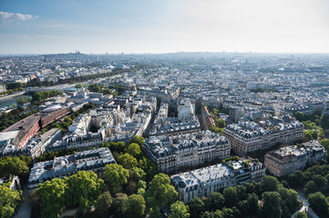 Wall Mural - Panoramic view from second floor of Eiffel tower in Paris. View of the buildings, parks with historical Monmartre on the background