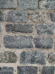 Wall Mural - Texture of dark gray granite paving stones, top view. Background from natural block stone.