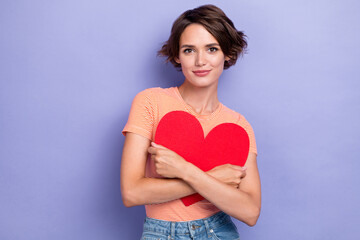 Sticker - Photo of positive tender lady wear striped outfit hand hug red paper card heart symbol present gift isolated on purple color background