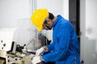 © winnievinzence - experienced operator technician worker or engineer metalworker industrial in safety helmet working or repair on metal machine, professional maintenance skill man in industry manufacturing. men at work