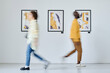 © AnnaStills - Blurred motion of young people walking along art gallery