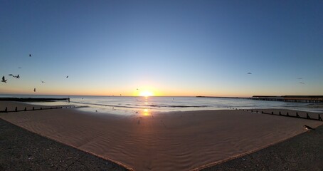 Wall Mural - Beautiful soft sunset over the beach