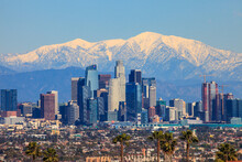 Downtown Los Angeles With Snow Capped Mountain In The Background