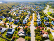 Autumn panorama of the streets of modern single-family houses of the upper and middle class. American real estate in Virginia USA. Drone view.