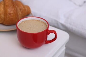 Wall Mural - Morning coffee and croissant on white table, closeup. Space for text