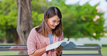 Sticker - asian woman reading on bench