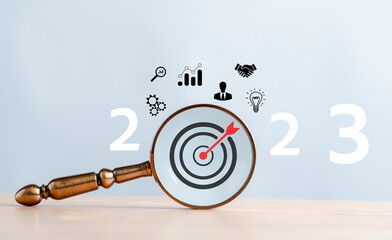 Aufkleber - Target business on 2023 year concept. Magnifier focus to dartboard icon. planning project, invest, innovation, idea to next year from end 2022, New year concept.