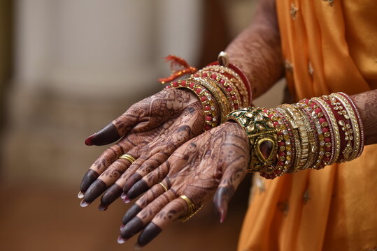 Mumbai, India 13th September 2022: Close-up shots of an Indian bride getting henna also known as Mehendi or mehndi done. Henna pattern. Traditional Rasam or rivaz of done with henna mehandi