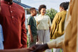 © Seventyfour - Side view of big African American family chatting outdoors during Summer party outdoors