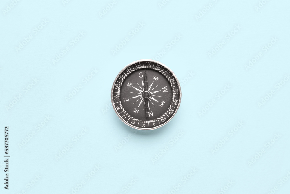 Vintage compass on blue background