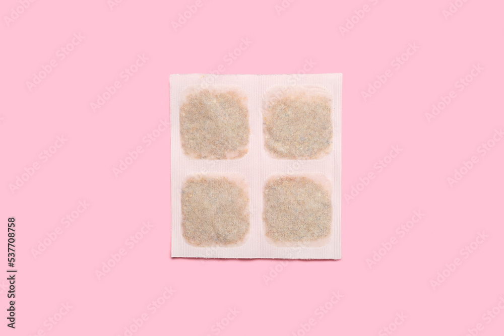 Mustard plaster on pink background