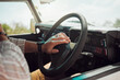 © K Abrahams/peopleimages.com - Steering wheel hands press car horn in road trip, traffic jam and journey. Closeup travel man, taxi driver and motor vehicle transportation sound for attention, caution and warning for driving street