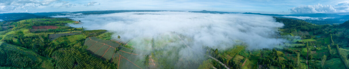 mountains in fog at beautiful autumn in phetchabun thailand. fog mountain valley, low clouds, forest